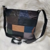 Genuine leather bag with three zippered pockets and a long handle