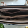 Lovely leather bag with three compartments and a long handle