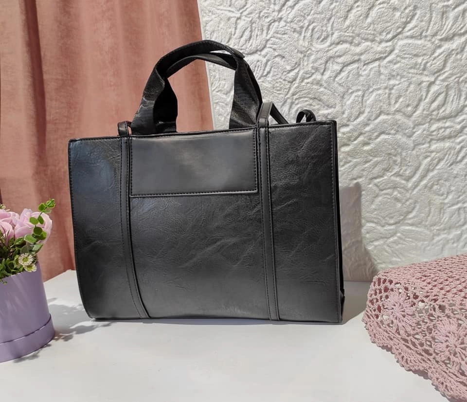 Lovely leather bag with three compartments and a long handle