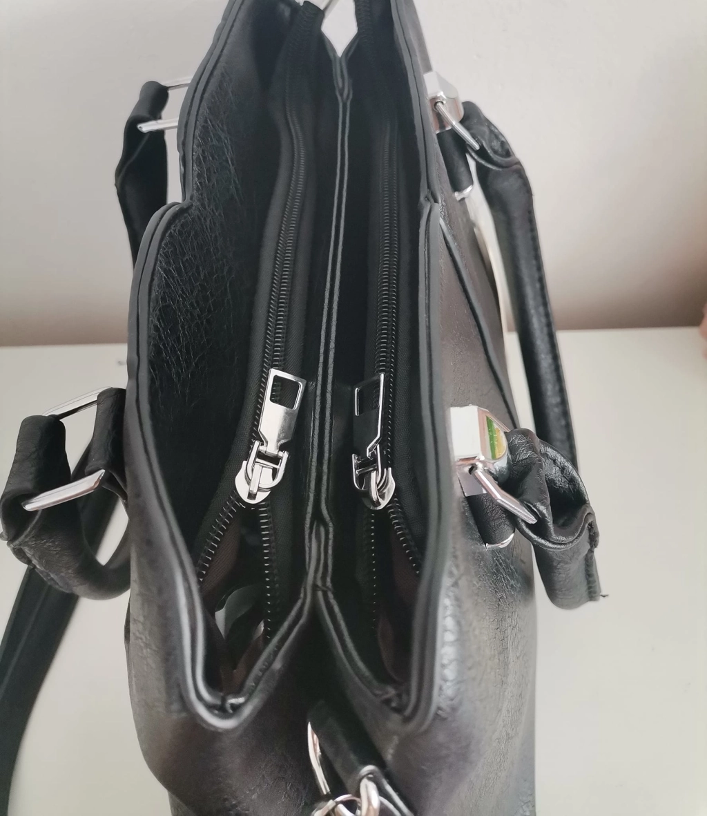 Comfortable leather bag with two compartments with separate zippers and an outer pocket