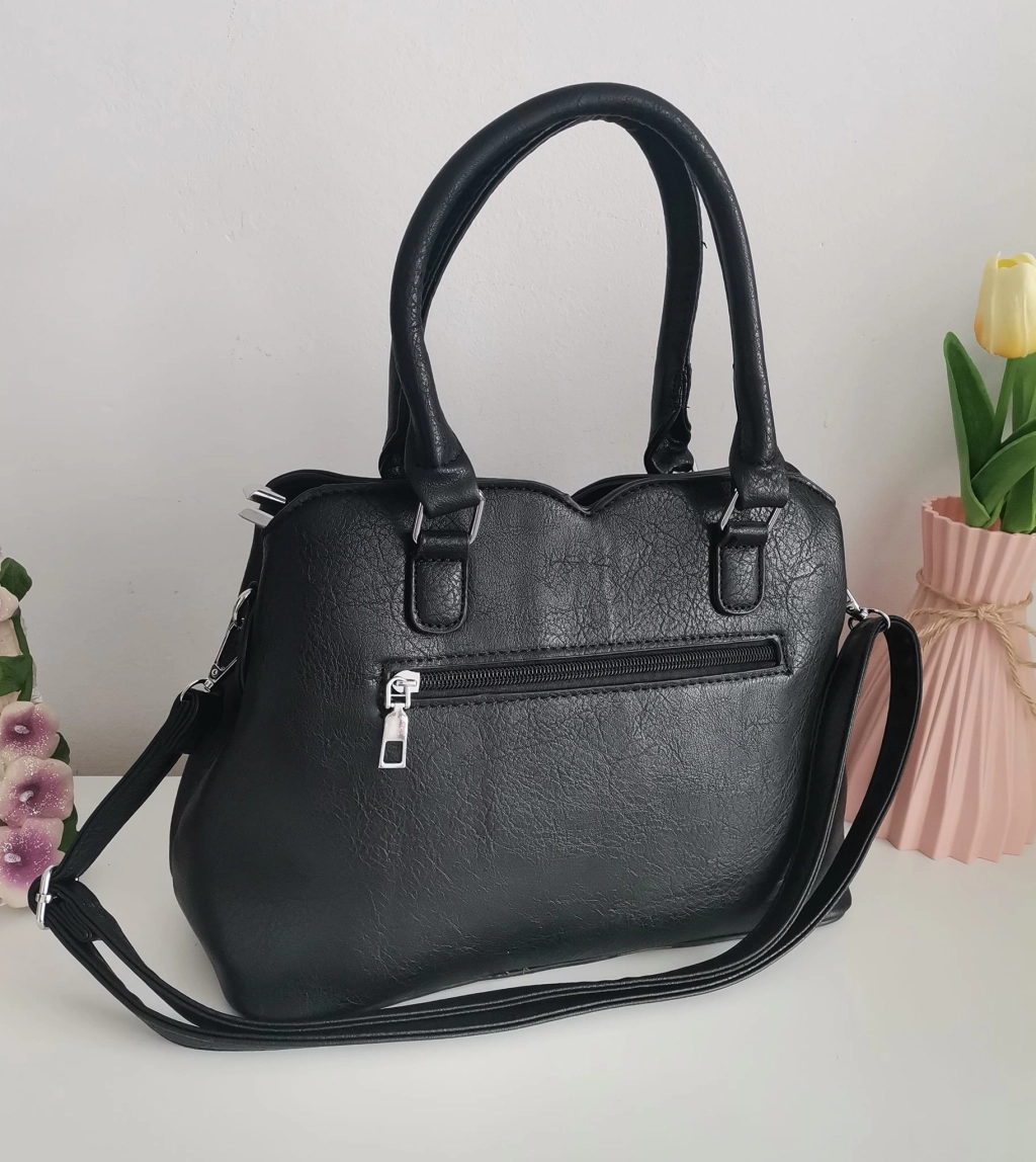 Comfortable leather bag with two compartments with separate zippers and an outer pocket