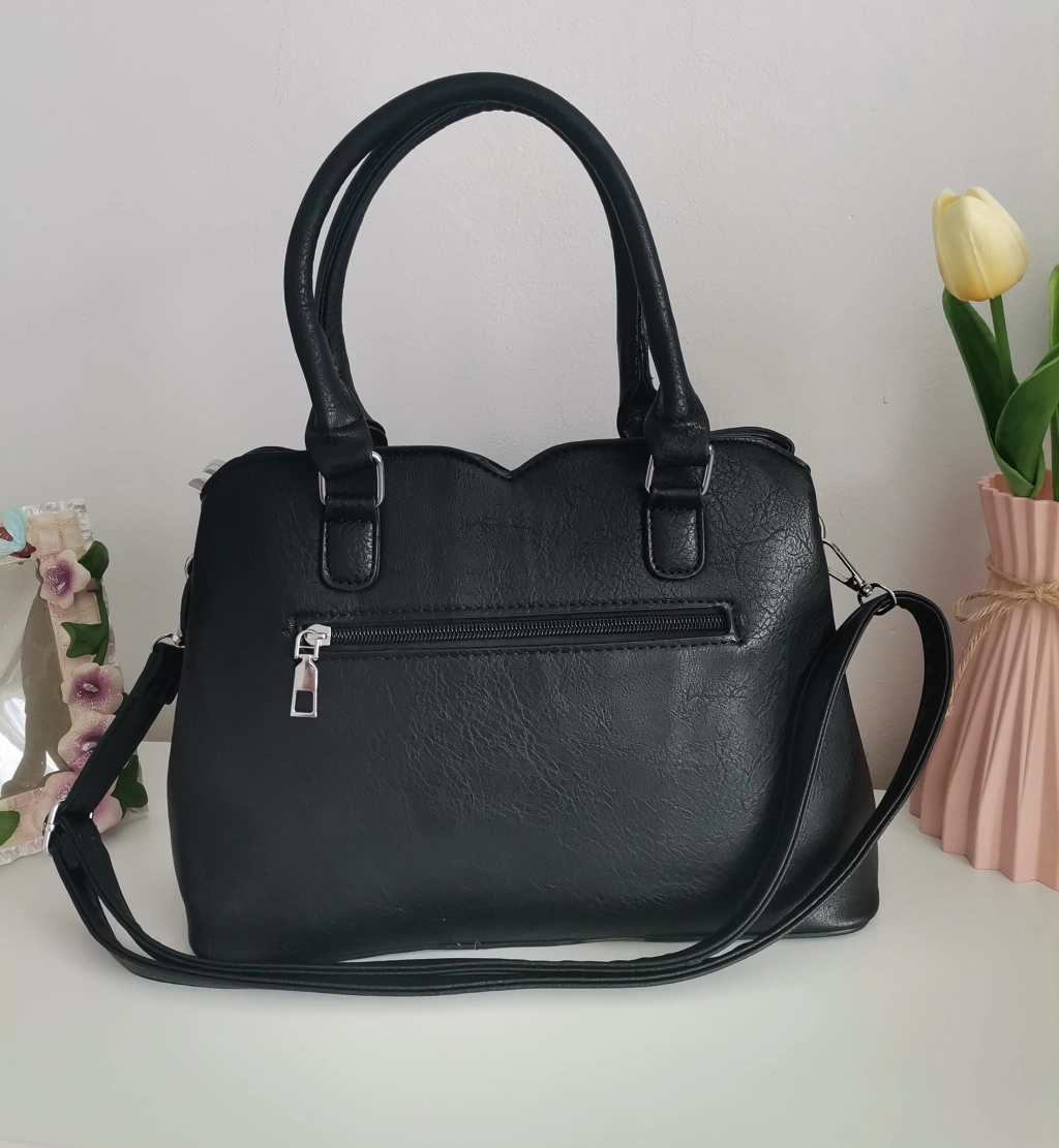 Comfortable leather bag with two compartments with separate zippers and an outer pocket