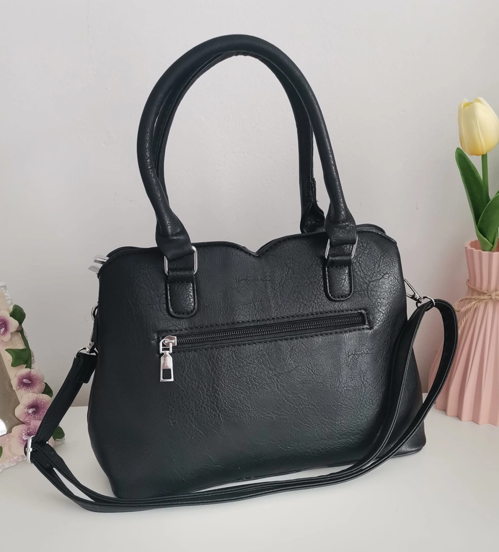 Comfortable leather bag with two compartments with separate zippers and an outer pocket