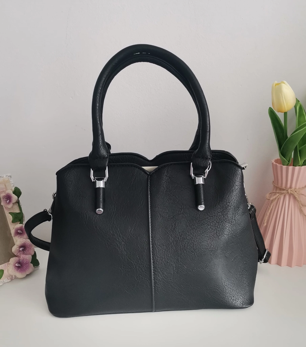 Comfortable leather bag with two compartments with separate zippers and an outer pocket