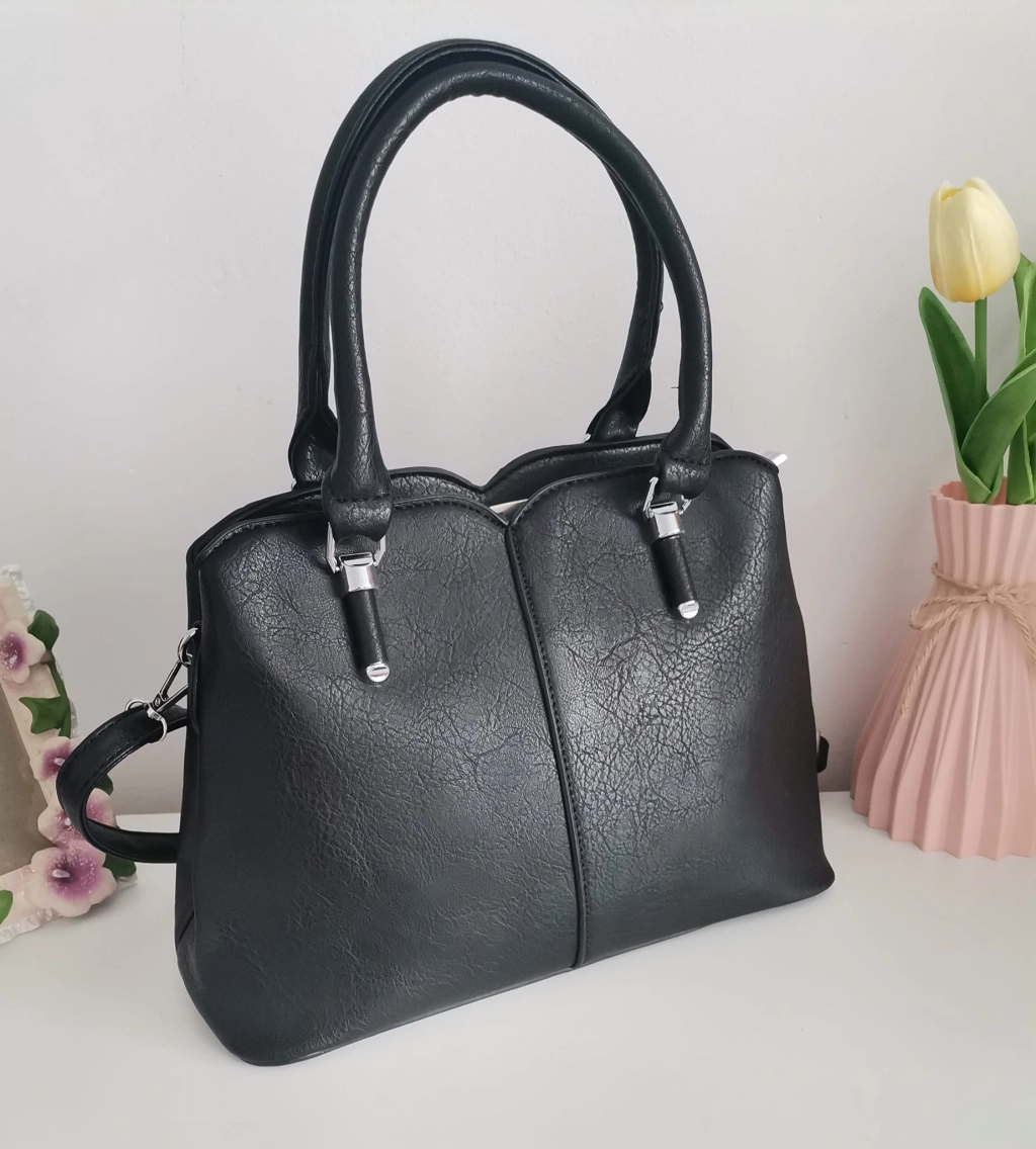 Comfortable leather bag with two compartments with separate zippers and an outer pocket