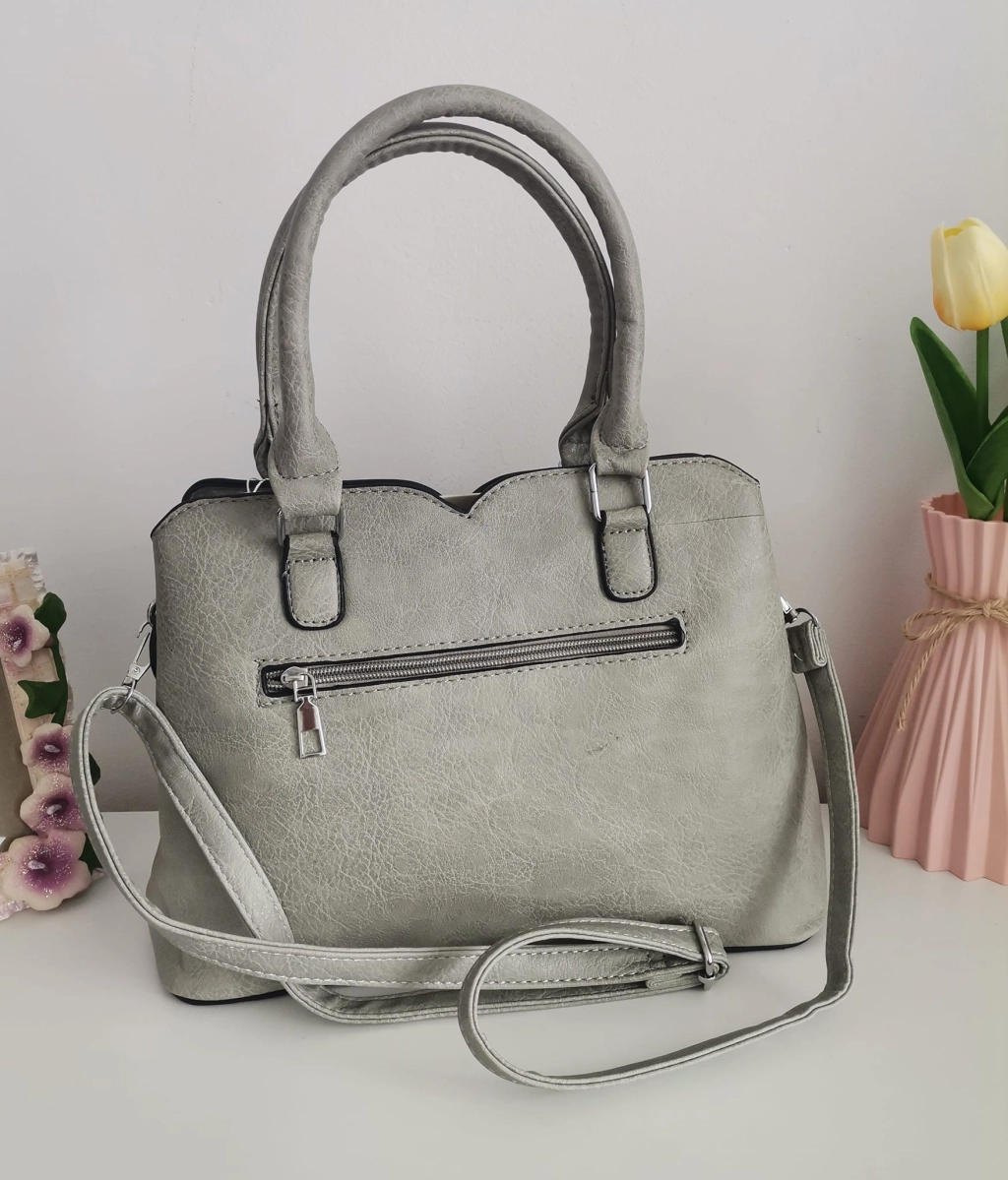 Comfortable leather bag with two compartments with separate zippers and an outer pocket