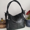 Comfortable large leather bag with three compartments with internal and external pockets