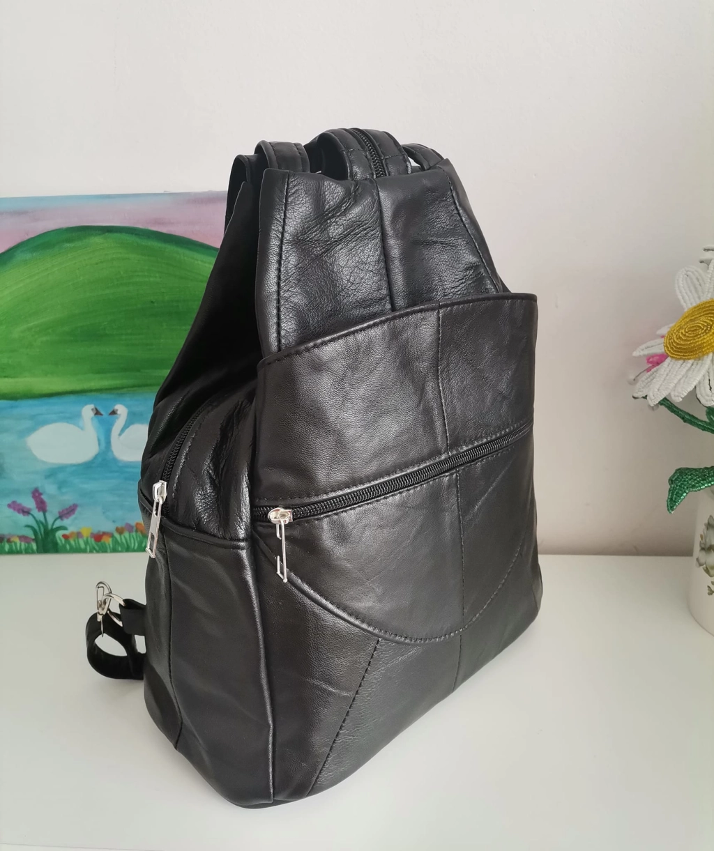 Genuine leather backpack with many pockets