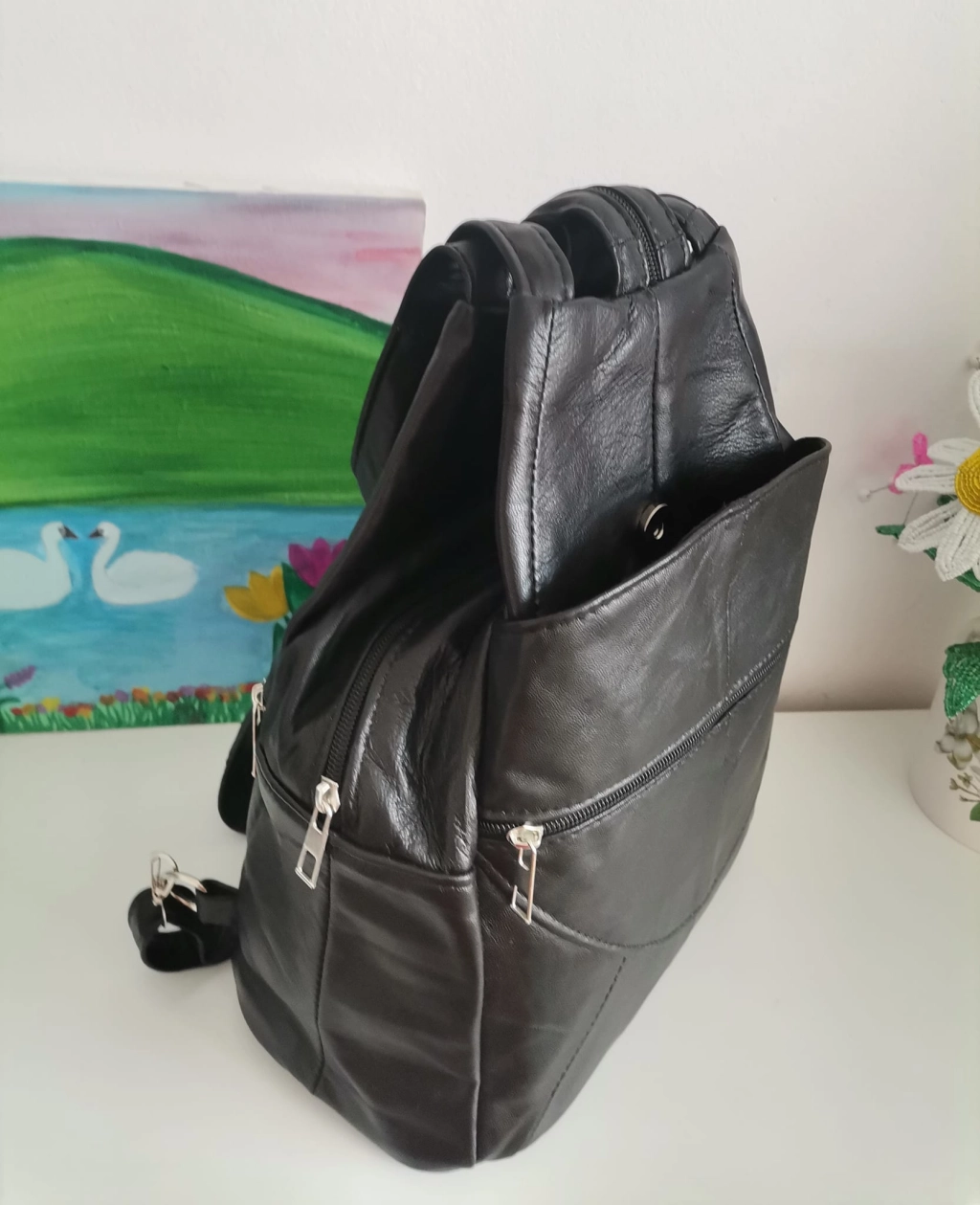 Genuine leather backpack with many pockets