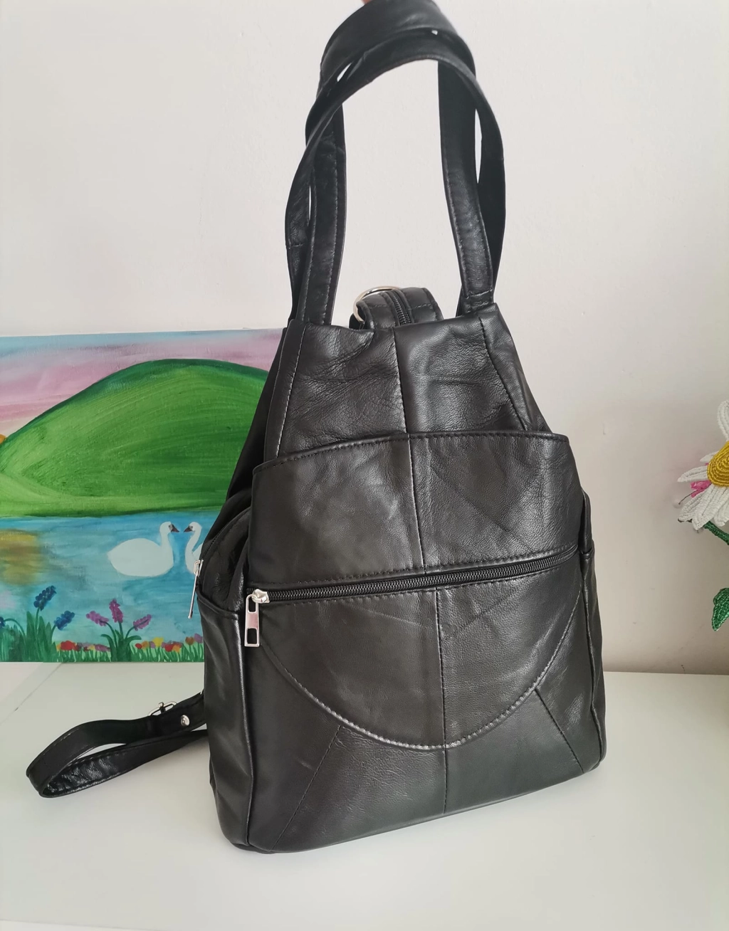 Genuine leather backpack with many pockets