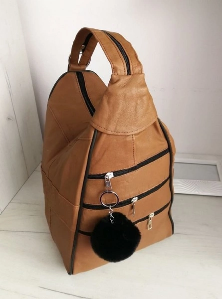 Genuine leather backpack with many compartments