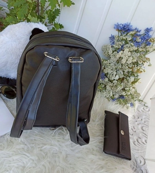 Black leather backpack with purse