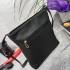 Μαύρη δερμάτινη τσάντα με μακριά λαβή και 4 τσέπες με φερμουάρ