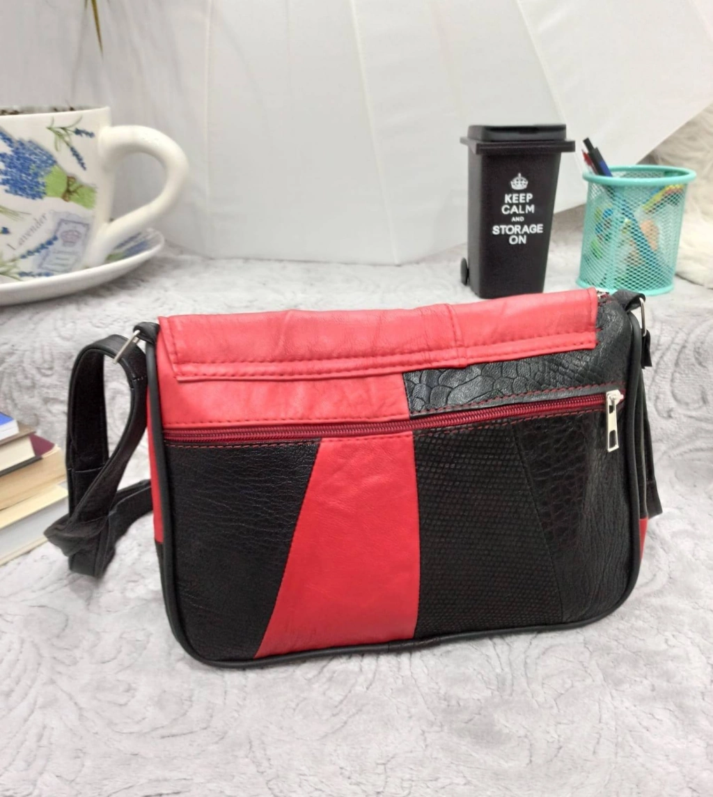 Genuine leather bag in black with red, with three pockets