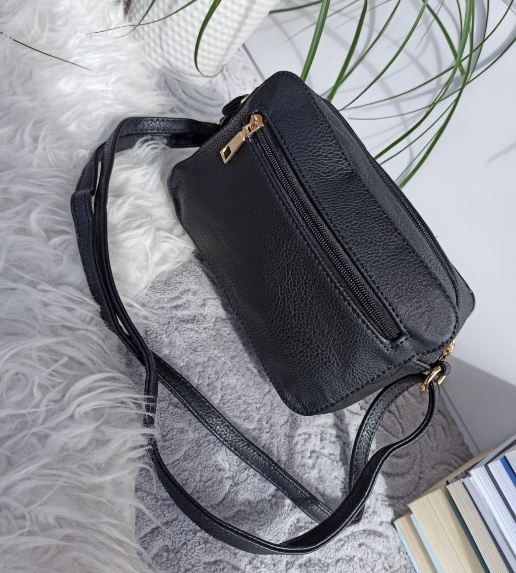 Lovely little colored bag with a long handle and a black back