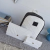 Set in white and black - backpack and bag with clutch and purse