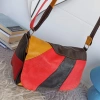 Genuine leather bag with three zippered pockets and a long handle